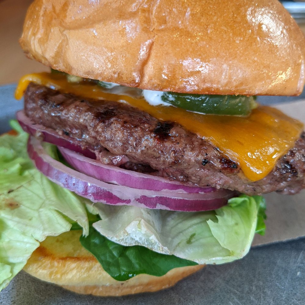 Village Burger Bar - Medium rare with cheddar and jalepenos - Burgers Near Me - Plano, Texas Village Burger Bar - Medium rare with cheddar and jalepenos - Burgers Near Me - Plano, Texas