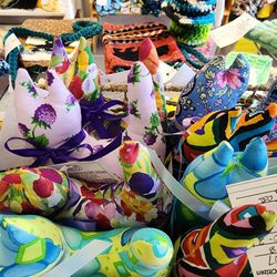 Handmade cat plushies in various patterned fabrics