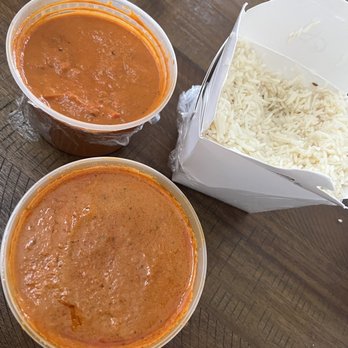 Punjab Cafe - Top:Chicken Tikka Masala (mild). Bottom: Butter Chicken (extra spicy). Basmati Rice. - Indian Near Me - San Jose, California Punjab Cafe - Top:Chicken Tikka Masala (mild). Bottom: Butter Chicken (extra spicy). Basmati Rice. - Indian Near Me - San Jose, California