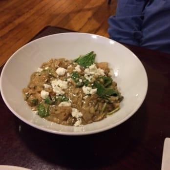 Amadeus - Chicken and Mushroom Risotto. The sauce is tangy and very salty. Could use a sprig of parsley at least to dress it up. - New American Near Me - Salem, Oregon