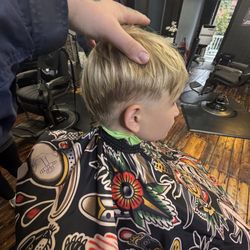 Jake's Chop Shop - This was the choppy hair cut he received from the owner of the place .