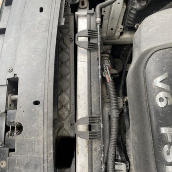 Reliable Auto - Radiator just dropped in. Not secured at all. Missing all bolts/screws/clips - Auto Repair Near Me - Manchester, New Hampshire Reliable Auto - Radiator just dropped in. Not secured at all. Missing all bolts/screws/clips - Auto Repair Near Me - Manchester, New Hampshire