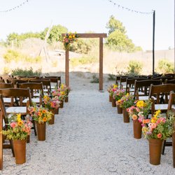Blue Heron Farms - DIY buckets from Blue Heron (arranged by our friends) and the arch done by Blue Heron, arranged by Kelly Brown who did a phenomenal job.