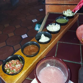 Las Fajitas - a row of bowls of food on a table - Mexican Near Me - Boca Raton, Florida Las Fajitas - a row of bowls of food on a table - Mexican Near Me - Boca Raton, Florida