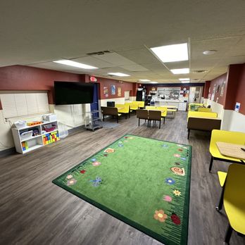Promise Land Learning Center - Our cafeteria area provides the perfect space for serving food as well as an area for children to play. - Child Care & Day Care Near Me - Conroe, Texas Promise Land Learning Center - Our cafeteria area provides the perfect space for serving food as well as an area for children to play. - Child Care & Day Care Near Me - Conroe, Texas