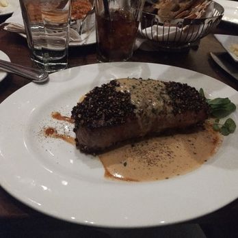 The Capital Grille - Dry Aged New York Strip Steak topped with Peppercorns - Steakhouses Near Me - Columbus, Ohio The Capital Grille - Dry Aged New York Strip Steak topped with Peppercorns - Steakhouses Near Me - Columbus, Ohio