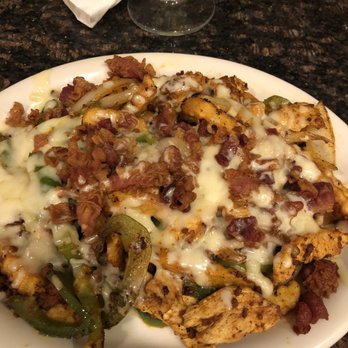 Los Agaves - Loaded fries on the bar menu. You won't be sorry ordering these unless you're into healthy stuff. Do it! - Mexican Near Me - White House, Tennessee