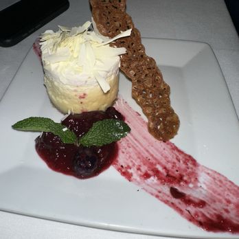 Perry's Steakhouse & Grille - Domain Northside - Cheesecake with raspberry compote - Steakhouses Near Me - Austin, Texas Perry's Steakhouse & Grille - Domain Northside - Cheesecake with raspberry compote - Steakhouses Near Me - Austin, Texas