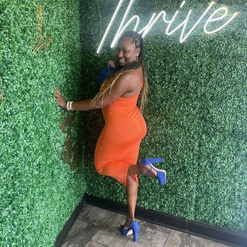 Thrive Restaurant and Bar - Signature grass backdrop - Bars Near Me - Memphis, Tennessee