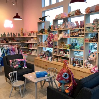 Hello Rainbow - Cute seating area with an array of toys around it - Toy Stores Near Me - Duluth, Georgia