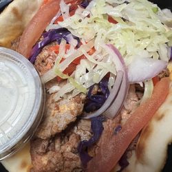 My Vision Nutrition - Steak Gyro: grilled steak, thin pita bread, red onion, cabbage, tomato, red peppers & tzatziki sauce.