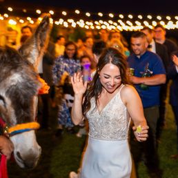 Isaac helping pass out drinks to everyone when the Tequila Donkey arrived