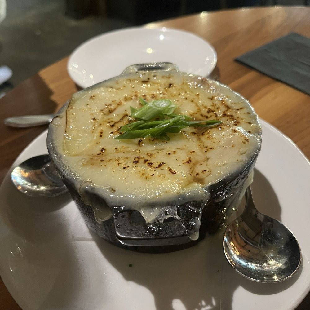 Steelbach - FRENCH ONION SOUP $18 braised short rib, brulée gruyère, chives - New American Near Me - Tampa, Florida Steelbach - FRENCH ONION SOUP $18 braised short rib, brulée gruyère, chives - New American Near Me - Tampa, Florida