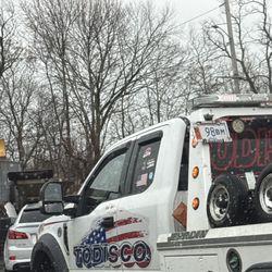 D and M Auto Doctor - Tow truck blocking the entrance and the owners don't give a