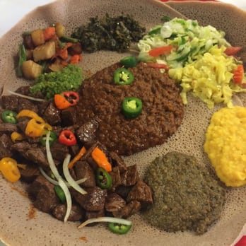 Lalibela Ethiopian Restaurant - Veggie platter with the gored gored added - Ethiopian Near Me - Omaha, Nebraska Lalibela Ethiopian Restaurant - Veggie platter with the gored gored added - Ethiopian Near Me - Omaha, Nebraska