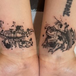 Freshly done wrist tattoos done in an adapted trash polka/ink splatter style. Freshly done wrist tattoos done in an adapted trash polka/ink splatter style.