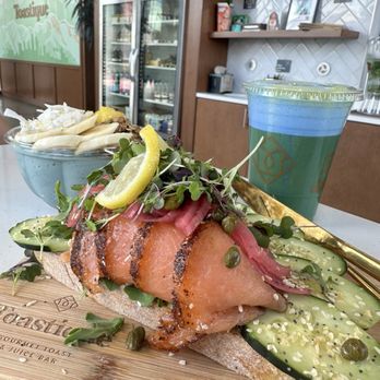 Toastique - Smoked Salmon Toast Blue Mystique Bowl and Iced Matcha with blue spirulina foam - Coffee & Tea Near Me - Los Angeles, California Toastique - Smoked Salmon Toast Blue Mystique Bowl and Iced Matcha with blue spirulina foam - Coffee & Tea Near Me - Los Angeles, California