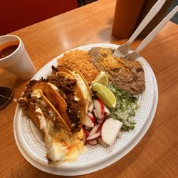 Quesabirria Tacos with rice and beans.