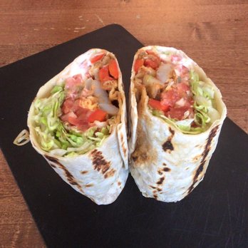 The Brassie Pub - two burritos on a cutting board - Pubs Near Me - Ancaster, Ontario The Brassie Pub - two burritos on a cutting board - Pubs Near Me - Ancaster, Ontario