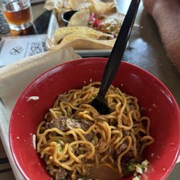 Vietnamese garlic street noodles... INCREDIBLE!  And half pictured is my husband's Indonesian pork belly tacos which he says are 12/10,