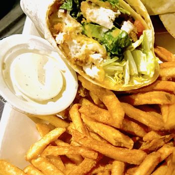The Kitchen at CUT! - Cypress - Fried chicken wrap and fries. The fries were horrible. - Cinema Near Me - Cypress, Texas