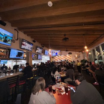Vida Mariscos - a large group of people sitting at a bar - Seafood Near Me - Katy, Texas