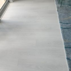 Sarasota Carpet & Flooring - A sample view of the luxury vinyl planks and the new carpet.