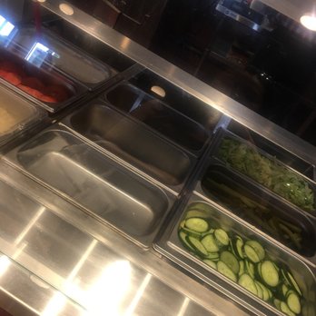 Toshka - Grill & Lounge - Chicken Shawarma wrap with just lettuce and pickles for almost 10 bucks.  Well, clearly they need the money to buy more ingredients. - Middle Eastern Near Me - Mississauga, Ontario