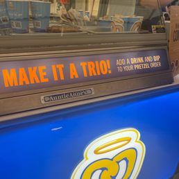 a blue truck with a sign that says make it a trio