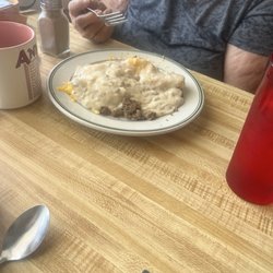 Kristin's Kafe - Egg scramble over a biscuit with gravy.