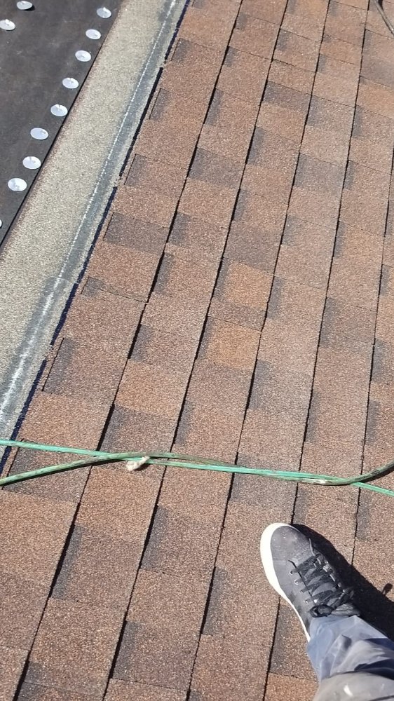 Slide of Extra Myles Roofing