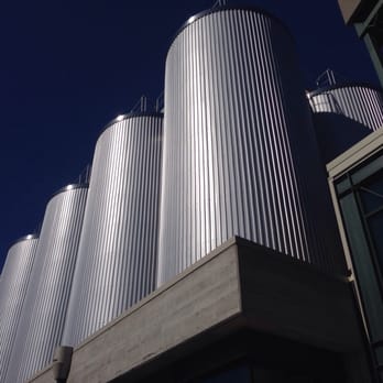 Deschutes Brewery Tasting Room - The gigantic fermenting tanks atop the brewery. - Breweries Near Me - Bend, Oregon