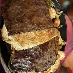 Tequilas Mexican Grill - The combination fajitas with the pounded steak, chicken breast, shrimp blanketing the mound of grilled veggies.