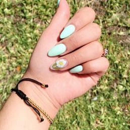 Gel almond acrylics with dried flower accent nail.