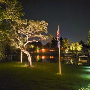 Omni Irrigation - a tree and a pond at night - Landscaping Near Me - Tampa, Florida Omni Irrigation - a tree and a pond at night - Landscaping Near Me - Tampa, Florida