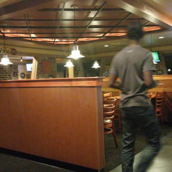 Pizza Hut - a man riding a skateboard in a restaurant - Pizza Near Me - Lanham, Maryland