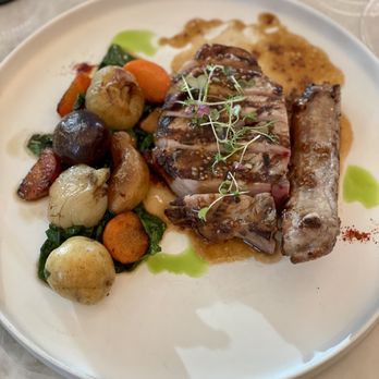 Le Jardinier - Pork chop with roasted root vegetables, spinach and mustard jus - French Near Me - Houston, Texas