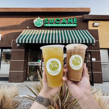 SuCane - two people holding drinks in front of sucane - Juice Bars & Smoothies Near Me - Gardena, California SuCane - two people holding drinks in front of sucane - Juice Bars & Smoothies Near Me - Gardena, California