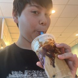 Me drinking the Milk Tea boba
