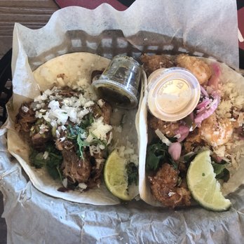 Torchy's Tacos - Carnitas taco on left, fried shrimp on right. Should have had two shrimp! So good! - Tex-Mex Near Me - Waco, Texas Torchy's Tacos - Carnitas taco on left, fried shrimp on right. Should have had two shrimp! So good! - Tex-Mex Near Me - Waco, Texas