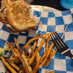 The food was so good I ate half before I remembered to take a picture. Club sandwich and fries. The food was so good I ate half before I remembered to take a picture. Club sandwich and fries.