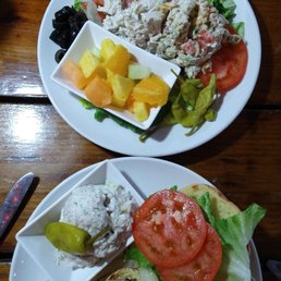 Top is the Chicken Salad Platter with Pasta Salad and Fruit. Bottom is the Shaw Nee Fish Sandwich ( dolphin) with Potato Salad Top is the Chicken Salad Platter with Pasta Salad and Fruit. Bottom is the Shaw Nee Fish Sandwich ( dolphin) with Potato Salad