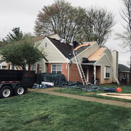 Peak Roofing Contractors replacing the roof on my townhouse.