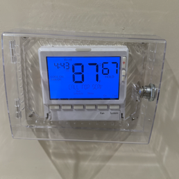 Photo of thermostat being at 87 degrees