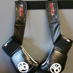 9Round Fitness - Boxing gloves hanging on the wall at 9Round Jacksonville