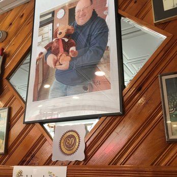 Johnny's Pizzeria - a man holding a teddy bear - Pizza Near Me - Mount Vernon, New York Johnny's Pizzeria - a man holding a teddy bear - Pizza Near Me - Mount Vernon, New York