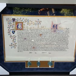 The Elements of Design Studio - The photo doesn't do it justice. Beautiful navy suede matte with a gold background. Really accentuates the gold & colors in the scroll.