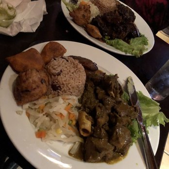 Footprints Cafe - Curry goat plate in front oxtail plate in the back - Bars Near Me - Brooklyn, New York Footprints Cafe - Curry goat plate in front oxtail plate in the back - Bars Near Me - Brooklyn, New York