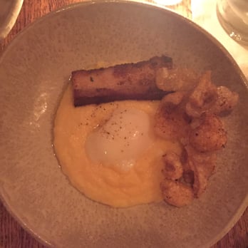 Andrew Michael Italian Kitchen - Grits, egg, pork belly, house made pork rinds. This was AWESOME. - Italian Near Me - Memphis, Tennessee Andrew Michael Italian Kitchen - Grits, egg, pork belly, house made pork rinds. This was AWESOME. - Italian Near Me - Memphis, Tennessee