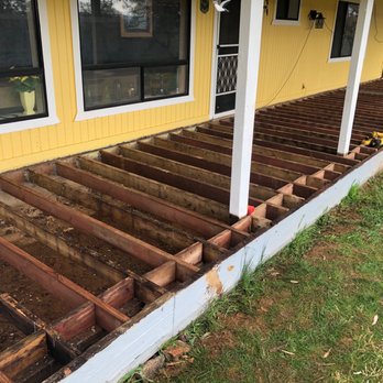 Ogden Construction - Old porch surface pulled off, new cross members with 12" centers - General Contractors Near Me